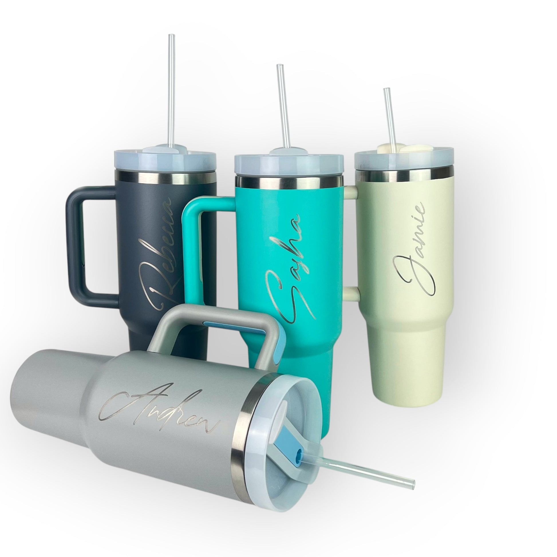 HouseEco 1.2L stainless steel travel mug with handle and straw, available in grey, navy, teal, and cream. Personalised with engraved names.