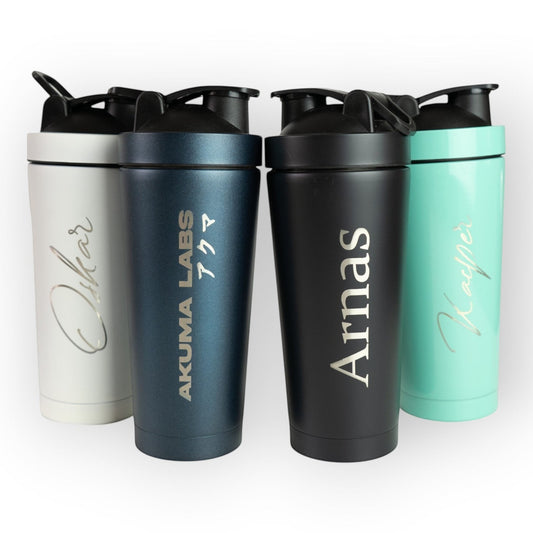 HouseEco engraved insulated 750ml protein shakers in white, teal, black, and navy blue with custom text and carry handles.