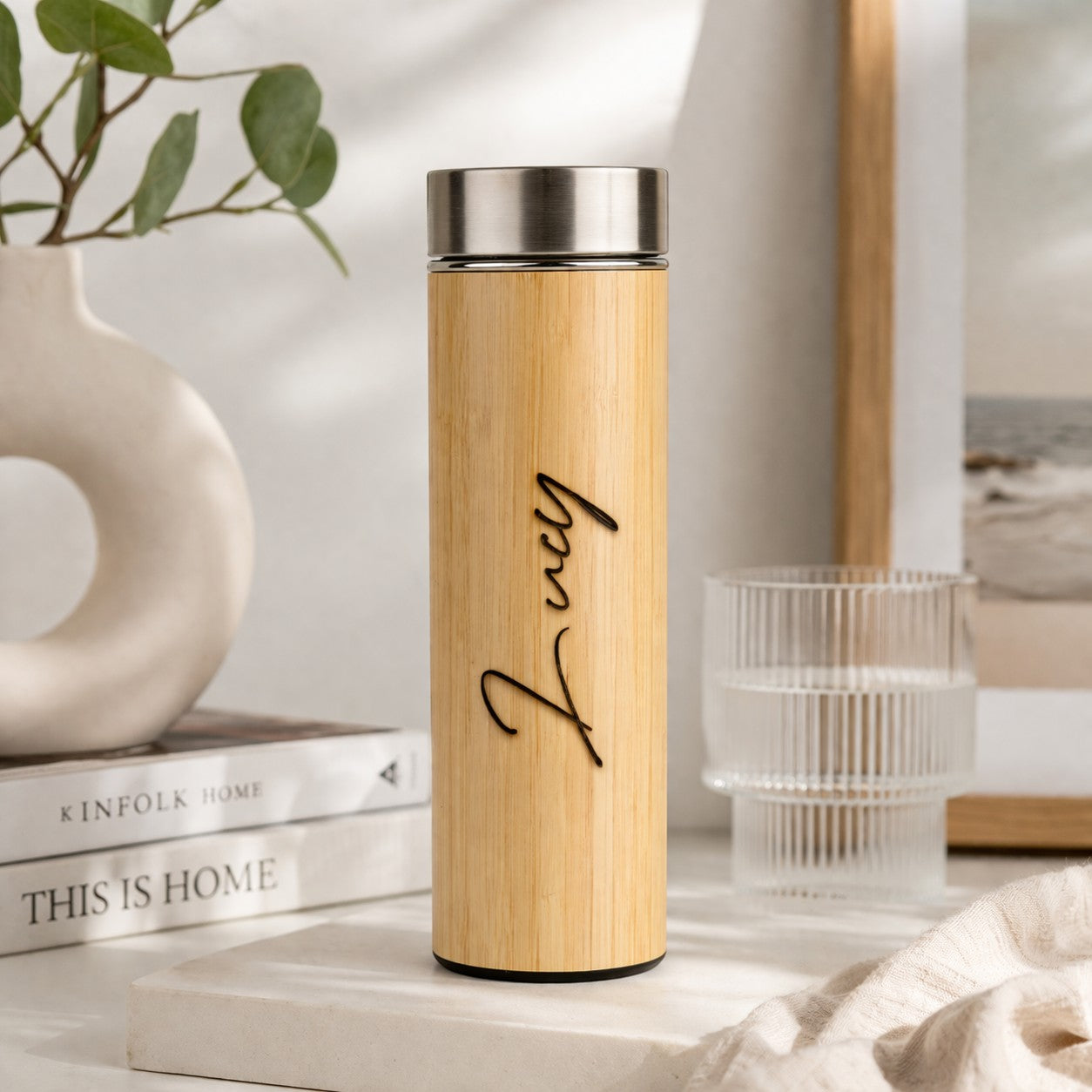 HouseEco personalised bamboo flask with silver lid and black text "Lucy". Insulated for hot or cold drinks.