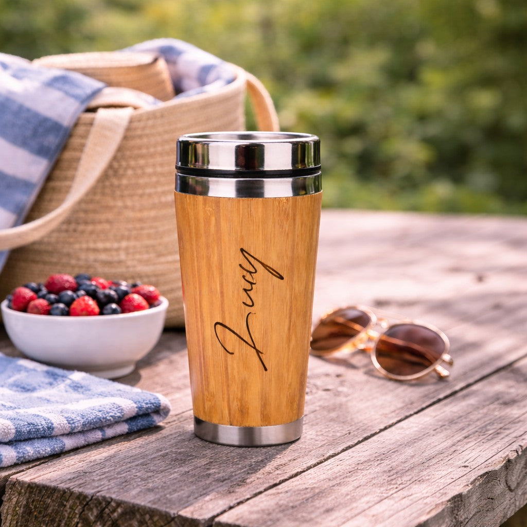 HouseEco personalised 500ml insulated bamboo travel mug with silver lid, featuring a name engraved on the front.