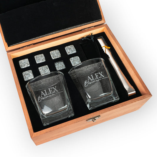 HouseEco personalised whiskey gift set with two engraved glasses, stone ice cubes, tongs, and wooden box.