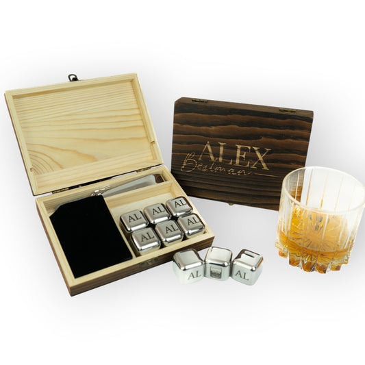 HouseEco personalised whiskey stones set with 9 engraved stainless steel ice cubes in a custom wooden box, with a whiskey glass.