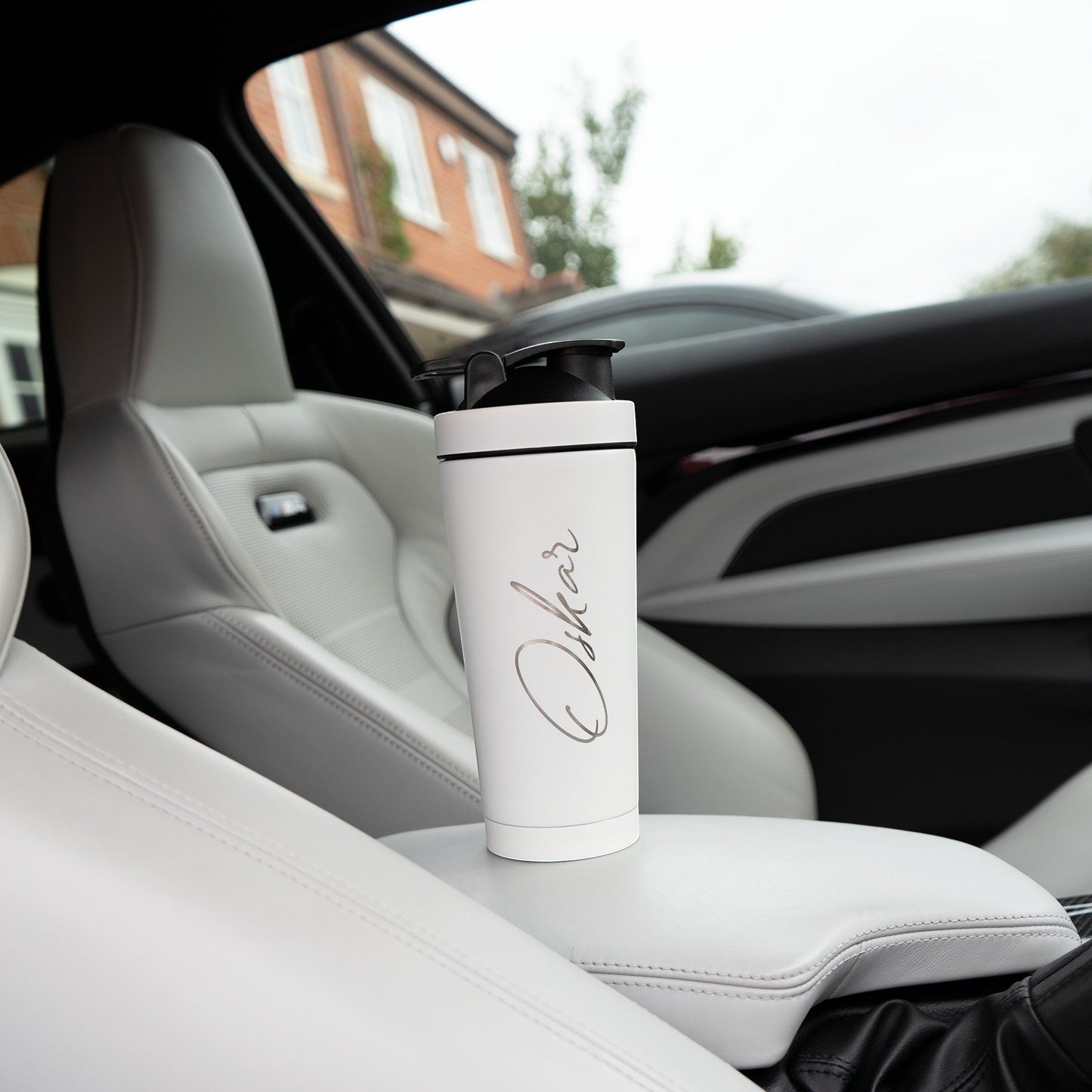 HouseEco white 750ML insulated metal protein shaker with black lid and engraved name. Leakproof design with carry handle.